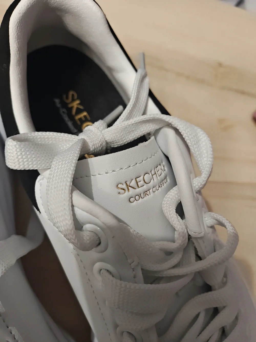 Skechers Men’s White Sneakers with Black Heel Accent 9